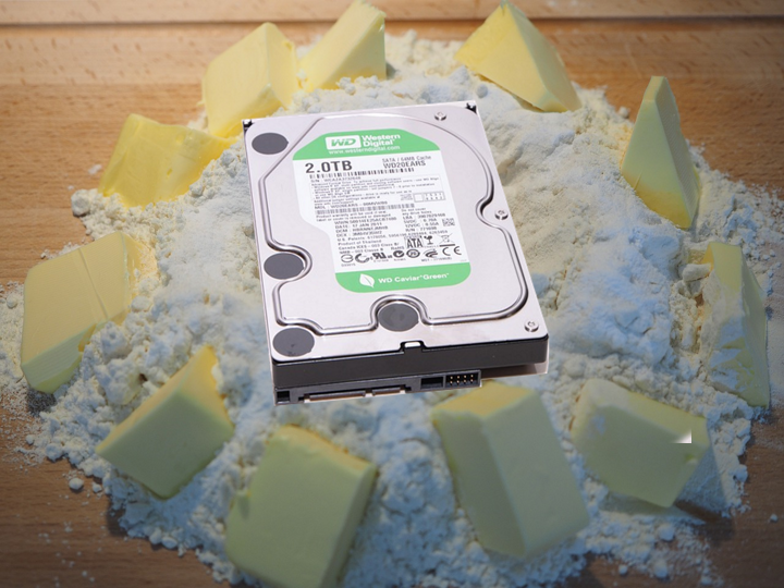 A Hard Drive on top of a pile of flour and butter